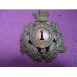 A 1st of Foot Light Infantry helmet plate