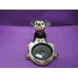 An early 20th century papier mache ashtray, modelled as Mickey Mouse