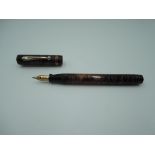 A Diamond Point fountain pen, circa 1950, Burgundy and transparent stripe, fine nib, bulb fill, good