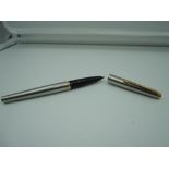 A Parker 45 fountain pen, circa 1964, Stainless steel with gold trim, medium nib, cartridge, good