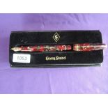 A boxed Conway Stewart 100 series fountain pen, 2009, in Poinsettia, fine nib, converter, limited