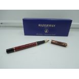 A boxed Waterman Special Edition fountain pen, 1997, Red marble, Black/gold trim, medium nib,