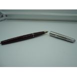 A Parker 65 fountain pen, circa 1969, Maroon, medium nib, aeromatic, good condition, made in the UK.