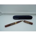 A boxed Waterman 55 fountain pen, circa 1928, Red Ripple Gold band, personalized on the band, and