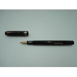 A Conway Stewart Custom fountain pen, circa 1938, black chased with a blank lozenge, lever fill,