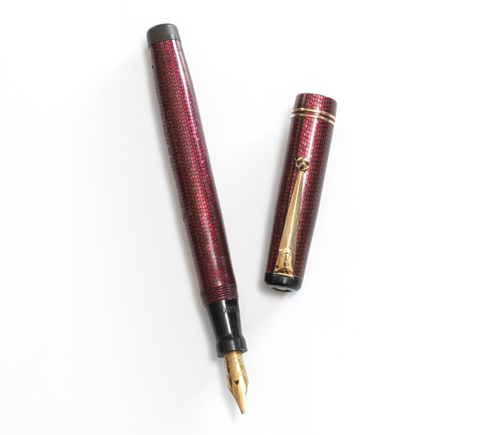 A Mabie Todd Swan fountain pen. A leverless Mabie Todd Swan fountain pen in garnet lizard skin