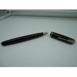 A Parker Vacumatic fountain pen, circa 1940, Gold and Brown shadow wave, fine nib, vacumatic, made