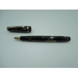 A Burnham fountain pen, circa 1950, in black and grey marble, broad nib, lever fill, very good