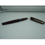 A Montblanc 22 fountain pen, circa 1950, Burgundy ink vue, piston fill, good condition, made in