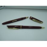 A Waterman L2 fountain pen and pencil set, circa 1950, Maroon with Gold trim, medium nib, lever