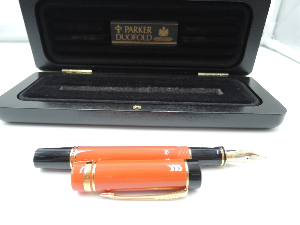 A Parker Duofold Centennial fountain pen, orange and black, circa 1990, in presentation box