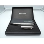 A boxed Faber-Castell Porsche Design Fountain pen, Tecflex Stainless Steel, medium nib, Converter,