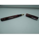 A Waterman Thorobred fountain pen, circa 1935, Red Black marble with Green veins, good condition,