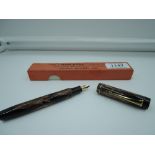 A boxed Non-Stop fountain pen by George Newnes Ltd, circa 1935, Brown and Black marble, button fill,