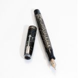 A Parker fountain pen. A Parker Vacumatic fountain pen with button fill and three narrow bands to