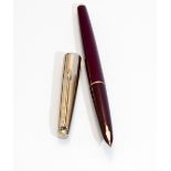 A Parker fountain pen. A Parker 61 in burgundy with gold cap