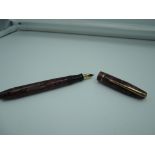 A Nova fountain pen 'The Nova Pen', circa 1930, Dark Rose marble, lever fill good condition