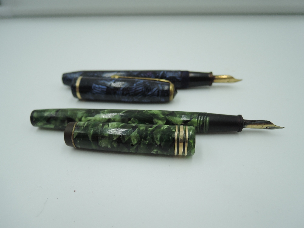 Two Conway Stewart fountain pens. A Conway Stewart 28 lined blue and a Conway Stewart 388 convex