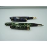Two Conway Stewart fountain pens. A Conway Stewart 28 lined blue and a Conway Stewart 388 convex