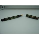 A Merlin 33 fountain pen, circa 1950, Green and Black striated, button fill, new sac fitted