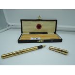 A boxed Myers Supa fountain pen , gold coloured with accompanying clip, lever fill, fair condition