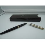 A boxed Parker 45 fountain pen, 1984, Black, stainless Steel cap and gold trim, fine nib, piston