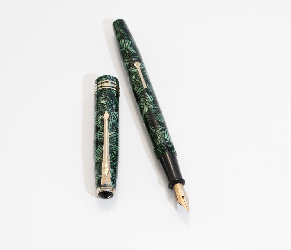 A Conway Stewart fountain pen. A Conway Stewart 28 lever fill in lined green and black, with three