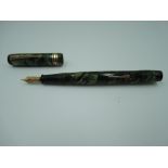 A Conway Stewart 388 fountain pen, circa 1939, green marble, medium nib, lever fill, fair condition,