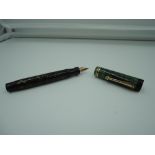 A Parker Lucky Curve Duofold Junior fountain pen, circa 1927, Jade Green, medium nib, button fill,