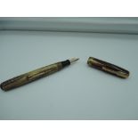 A Waterman fountain pen, Toffee Ripple, medium nib, lever fill, good condition, made in the UK