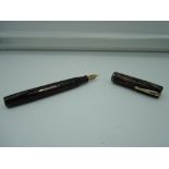 A Waterman 92v fountain pen, 1933, Green Gold marble military clip, broad nib, lever fill, very good