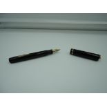 A Sheaffer ring top fountain pen, Black, one gold band on the cap, medium nib, lever fill, made in