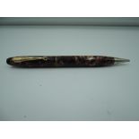 A Parker Parkette mechanical pencil, circa 1936, Ruby flake, good condition, made in Canada