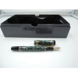 A Parker Duofold International fountain pen, circa 1990, marbled green, in original box