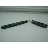 A fountain pen The American in green, medium nib, lever fill, good condition, made in the USA