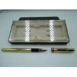 A boxed Colibri fountain pen, gold with black trim, fine/ medium nib, converter, very good condition