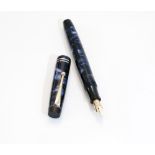 A Parker fountain pen. The Parker Streamlined Duofold fountain, button fill, in black and blue