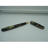 A Wearever fountain pen, circa 1940, Green marble ink vue, fine nib, lever fill, good condition,