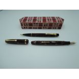 A boxed Conway Stewart 12 fountain pen and Nippy pencil set, burgundy marble, medium nib, lever