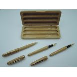 A boxed Amish fountain pen, pencil and ballpoint set in wood. The fountain pen is cartridge in