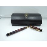 A boxed Conway Stewart Dura fountain pen, Red marble, fine nib, converter 83/200, made in the UK