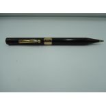 A mechanical pencil, black with gold band personalised and dated 1933