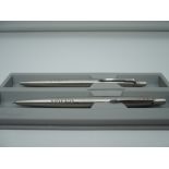 A boxed Parker set with Volvo Livery, brushed Stainless steel, good condition, made in the UK