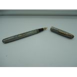 A Waterman fountain pen, Grey woodgrain, lever fill, fair condition