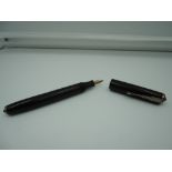 A Platignum English Warranted fountain pen, 1950, Black Hard Chased Rubber, bulb fill, very good