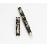 A Mabie Todd Swan fountain pen. A Swan leverless fountain pen in green and black with pearlescent