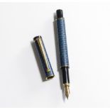 A Redens fountain pen. A boxed Redens fountain pen with blue leather coated barrel and cap