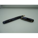 A Golden Guinea fountain pen, Blue marble, button fill, very good condition