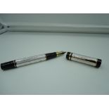 A fountain pen, Silver chased with Black and Gold trim, medium nib, cartridge, made in Germany