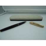 A boxed Parker 61 Consort fountain pen, circa 1968, Black with rolled gold cap, medium nib,